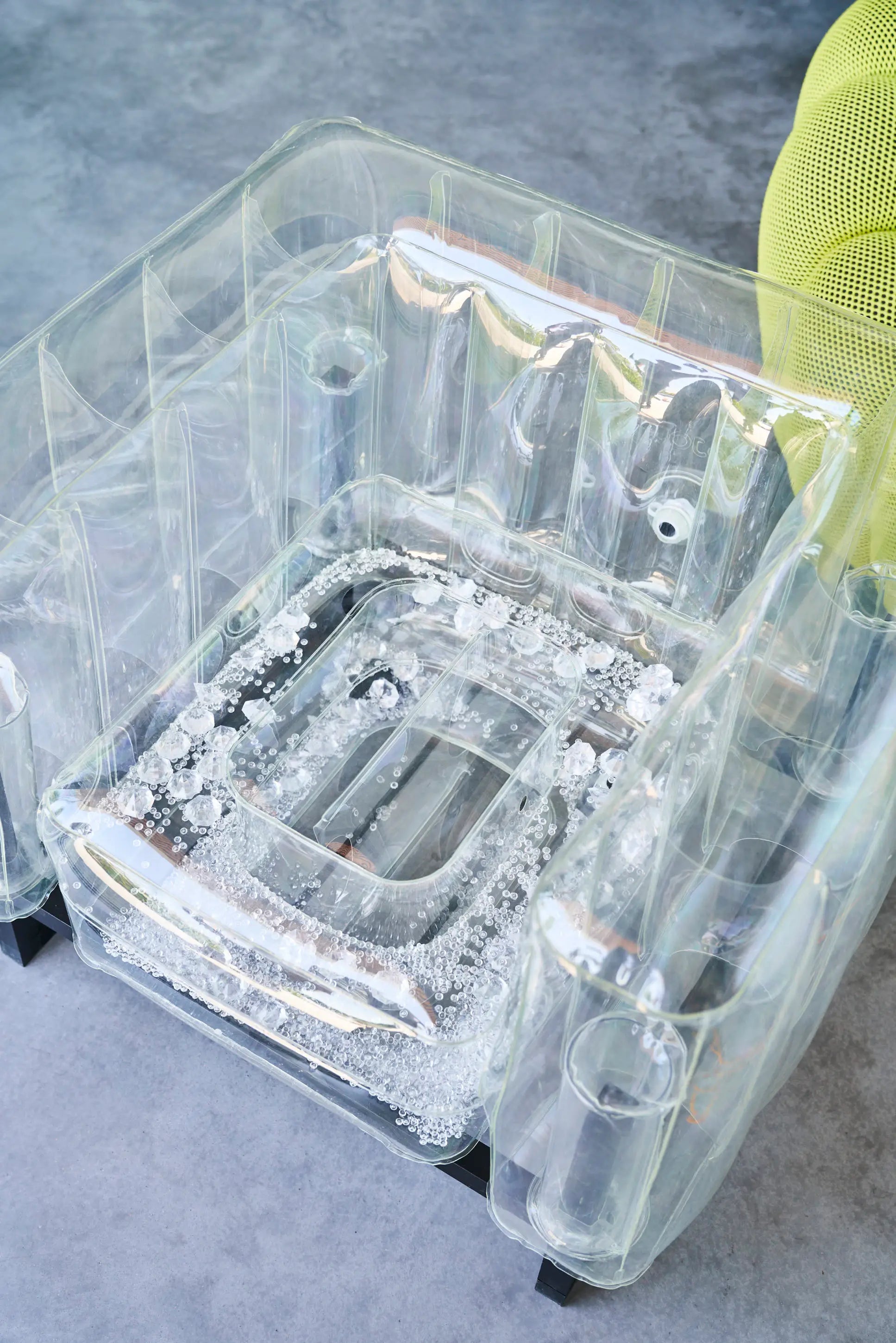 Design armchair in aluminum and transparent TPU